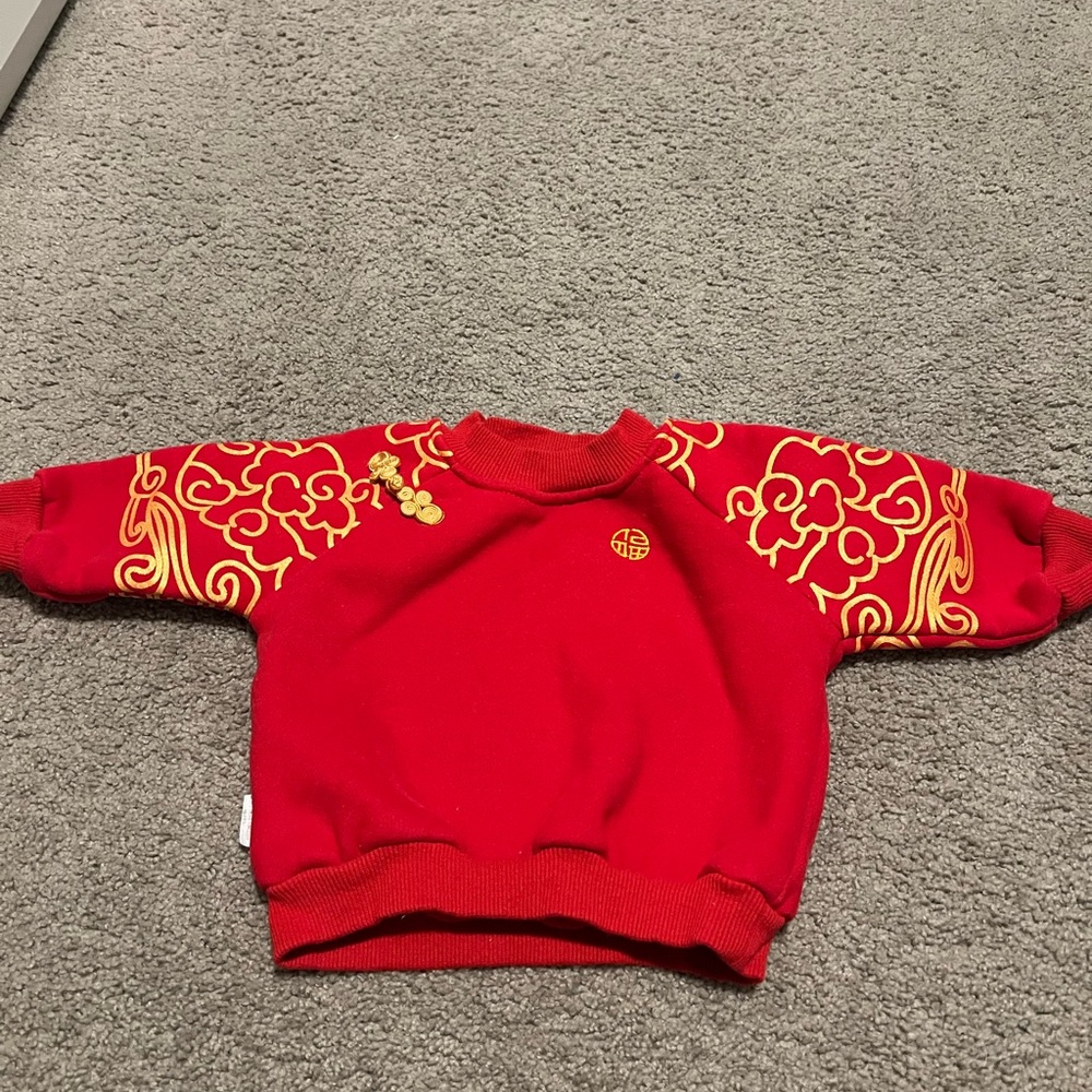 Red and Gold Sweater with Floral Sleeve Designs